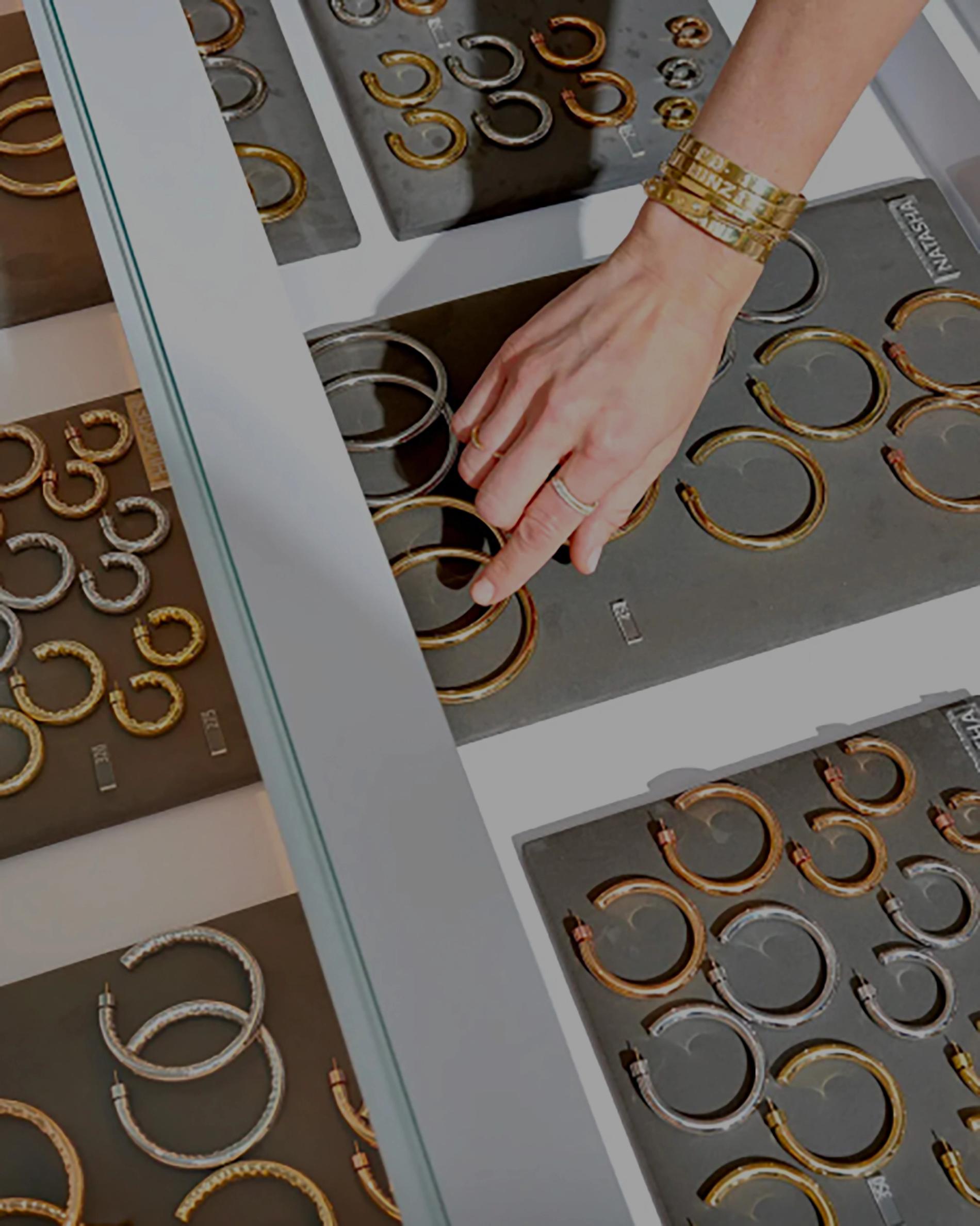 Hoops with a hand guiding a customer to purchase a pair